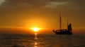 Sunset and sailing ship on the sea Royalty Free Stock Photo
