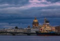 Sunset in Saint Petersburg over the Neva river with the view of the Blagoveshchenskiy Bridge and the Saint Isaac& x27;s Cathedral Royalty Free Stock Photo