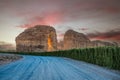 Sunset sandstone elephant rock erosion monolith standing in the desert, with road in foreground, Al Ula, Saudi Arabia Royalty Free Stock Photo