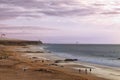 Sunset on a sandy beach with kite surfers Royalty Free Stock Photo