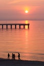 Sunset on the sandy beach by the sea Royalty Free Stock Photo