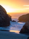 Sunset at sandy beach with sea stacks