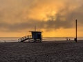 Sunset at Santa Monica Beach, California with dramatic clouds and breaking waves Royalty Free Stock Photo