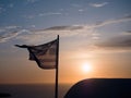 Greek flag against the Sunset in Santorini island, Greece Royalty Free Stock Photo