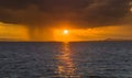 Sunset scene over the lake with rainy storm Royalty Free Stock Photo