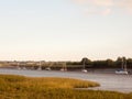 Sunset scene over river through country with moored boats and cl Royalty Free Stock Photo