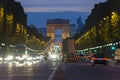 Sunset scene in Paris city. Long exposure photo of street traffic near Arc de Triomphe