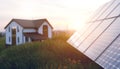 Sunset scene of solar panels and house in picture, green energy concept