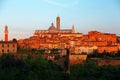 Sunset scenery of Siena, a beautiful medieval town on a hilltop in Tuscany Italy, with a view of architectural landmarks, Mangia T Royalty Free Stock Photo