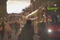 Sunset scenes from the center of Bern with people on the street, tourist sights and legendary trams or buses.