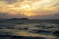 Sunset scenic powerful windy moving sea wave view with light reflection and beautiful shades of soft orange color sky background