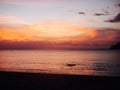 Sunset on the sea in bali with view on the oranges clouds