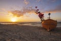 Sunset on the sea beach, boats on the sand Royalty Free Stock Photo