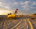 Sunset on the sea beach, boats on the sand Royalty Free Stock Photo