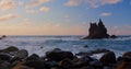 Sunset, sea beach, volcanic rocks in ocean waters. Tenerife Island, Playa de Benijo. Beauty of nature, travel Royalty Free Stock Photo