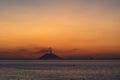 Volcano Stromboli smoking in the sunset