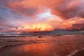 Sunset on the sea, beautifully highlighted clouds, waves on the Baltic coast. Royalty Free Stock Photo