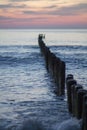 Sunset on the sea, breakwaters Royalty Free Stock Photo