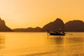 Sunset sea calm ocean with silhouette of fishing boat Royalty Free Stock Photo