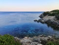 Sunset on sea and cliffs surrounding