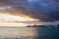 Sunset in sea with dramatic cloudy Malaga sky