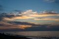 Sunset at the sea. Evening sun and path. Beautiful sky and clouds. Landscape on the coast. Ocean shore. Dawn. Nature