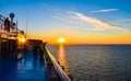 Sunset on the sea between Germany and Denmark on the Fehmarnbelt waterway, with a view from aboard a passenger ship