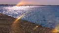 Pink Sunset on sea in Harbor water wave reflection seashell sky scape seascape sea stone birds on sky light sun boat in p