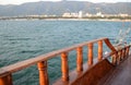 Sunset in the sea, sunset on the horizon, wooden railing of a pleasure sailboat.