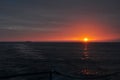 Sunset in the Sea of Japan. Cruiser `Varangian`.