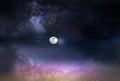 Milky way galaxy nebula   dark pink lilac  blue sky dramatic night clouds and bright full moon nature landscape Royalty Free Stock Photo