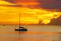 Sunset in sea and sailing yacht silhouette with beautiful landscape of Caribbean