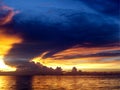 sunset sea ship on horizon line and night cloud Royalty Free Stock Photo