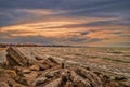 Sunset at the sea shore of a beach with rocks and stormy waves, beautiful seascape at Caspian sea Absheron, Azerbaijan Novkhani