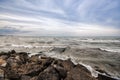 Sunset at the sea shore of a beach with rocks and stormy waves, beautiful seascape at Caspian sea Absheron, Azerbaijan Novkhani