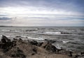 Sunset at the sea shore of a beach with rocks and stormy waves, beautiful seascape at Caspian sea Absheron, Azerbaijan Novkhani