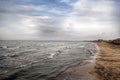 Sunset at the sea shore of a beach with rocks and stormy waves, beautiful seascape at Caspian sea Absheron, Azerbaijan Novkhani