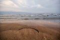 Sunset at the sea shore of a beach with rocks and stormy waves, beautiful seascape at Caspian sea Absheron, Azerbaijan Novkhani Royalty Free Stock Photo