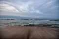 Sunset at the sea shore of a beach with rocks and stormy waves, beautiful seascape at Caspian sea Absheron, Azerbaijan Novkhani Royalty Free Stock Photo