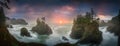 Sunset between Sea stacks with trees of Oregon coast Royalty Free Stock Photo