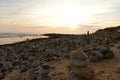 Sunset and sea stone towers at Vila Nova de Milfontes beach Royalty Free Stock Photo