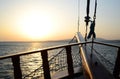 Sunset in the sea, sunset on the horizon, wooden railing of a pleasure sailboat.