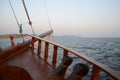 Sunset in the sea, sunset on the horizon, wooden railing of a pleasure sailboat.