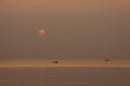 Sunset sea in twilight tone sky and reflection on water.