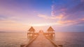 Sunset seacoast skyline with walk way leading to ocean Royalty Free Stock Photo