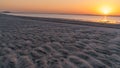 Sunset in Sealine with beautiful sand pattern emerged due to low tide Royalty Free Stock Photo