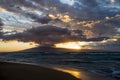 Sunset Seascape with Clouds Like Mothership Over Island on Horizon