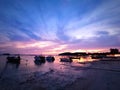 Sunset at seaside full with speed boat and colourful skyline of beautiful scenic view Royalty Free Stock Photo