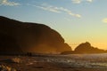 Sunset at the seaside, people silhouette on the beach Royalty Free Stock Photo