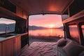 Sunset seen from back of camper van with amazing landscape. Concept of nature and having freedom in holiday